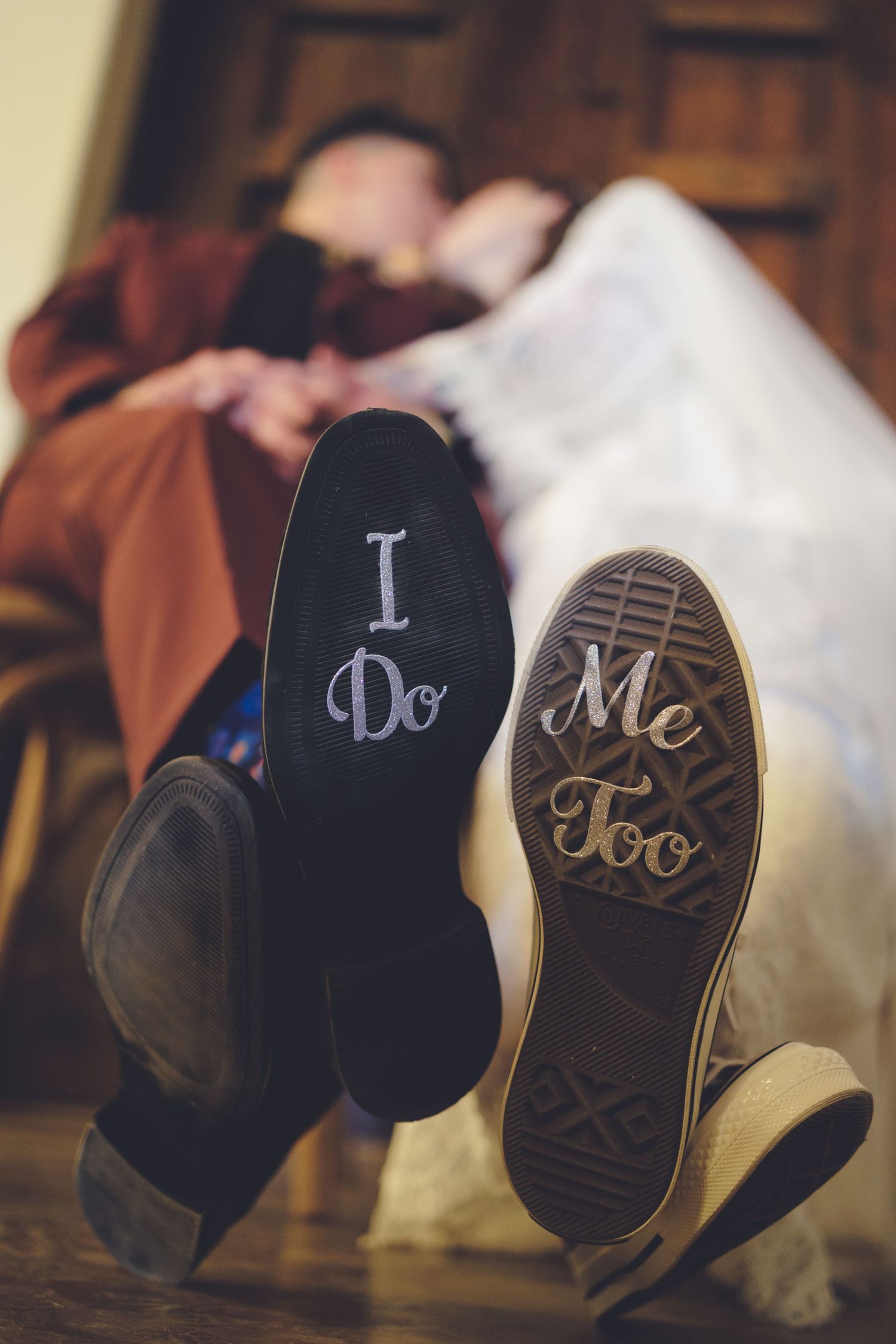 Matching shoes with "I do" and "me too" displayed on the soles.