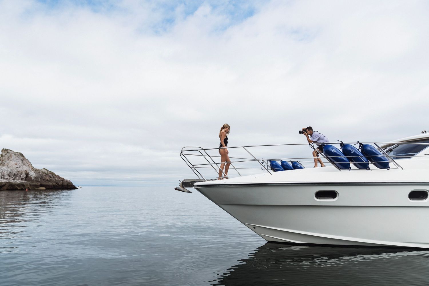 Girl on boat being photographed