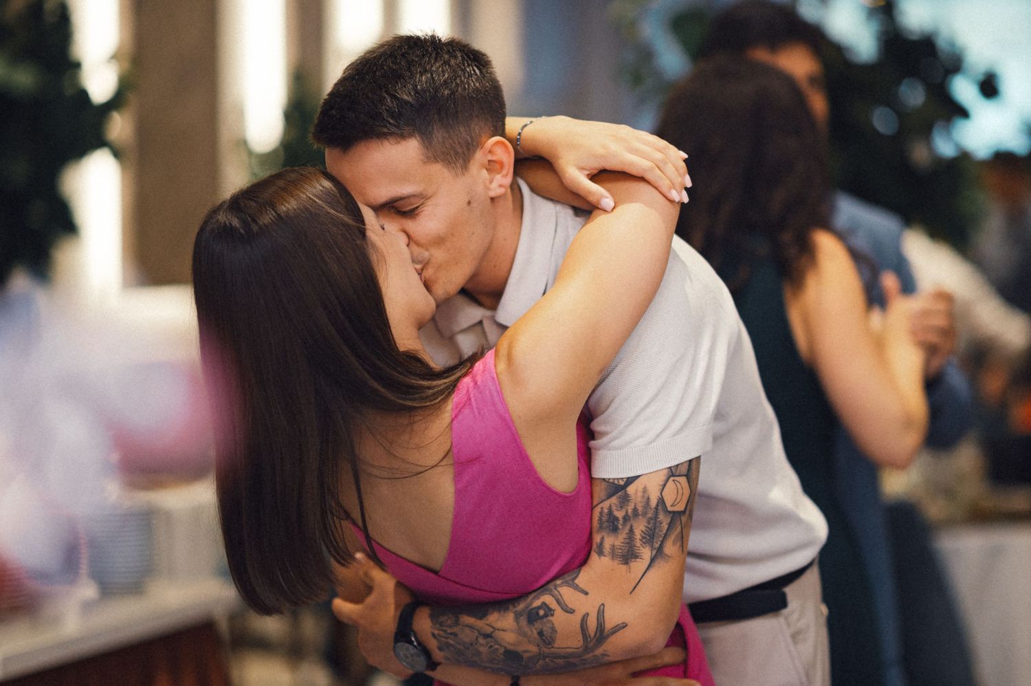 An intimate dance moment between a couple during a celebration.