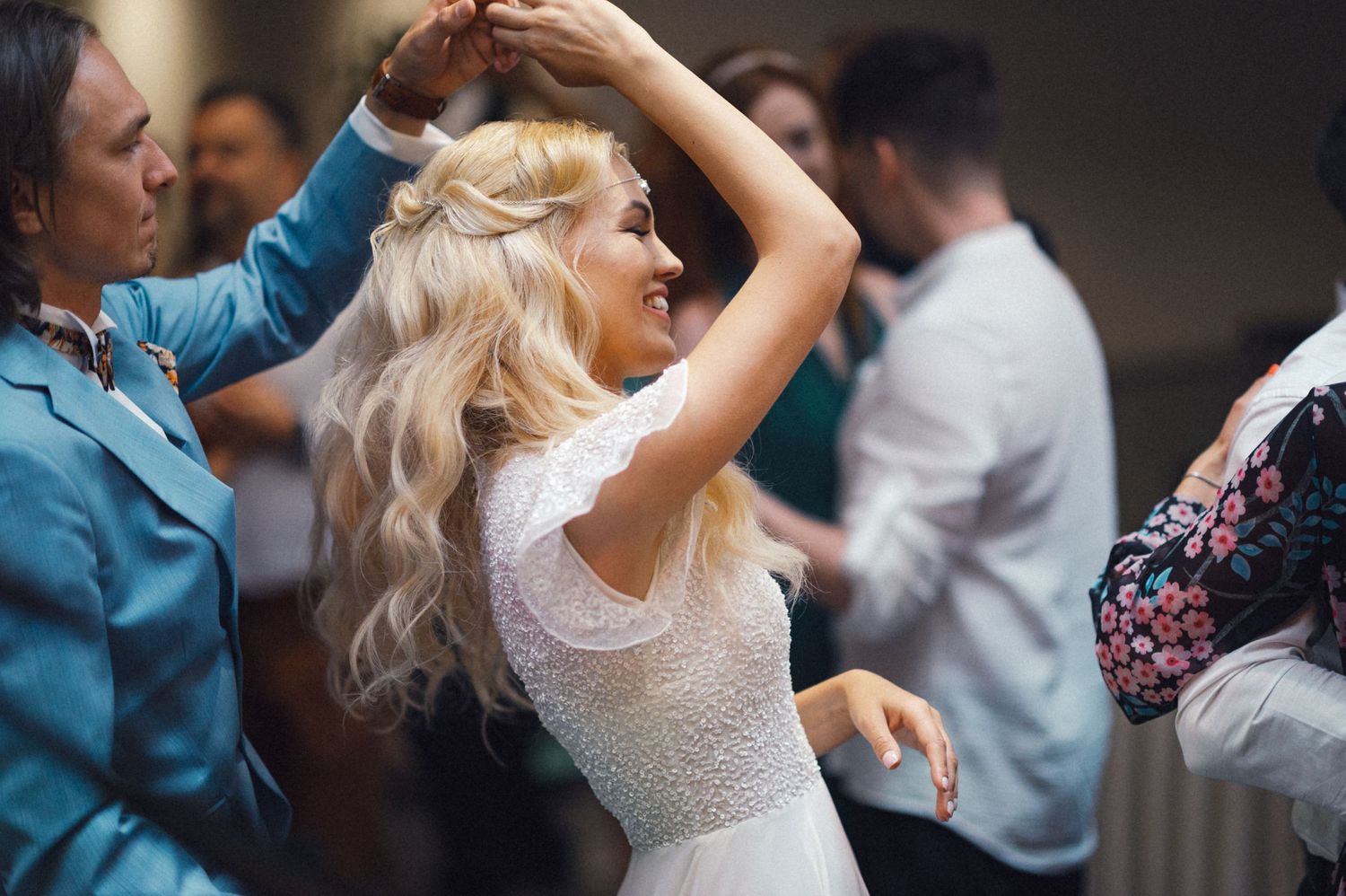 A festive dance scene showing people enjoying themselves at a celebration.