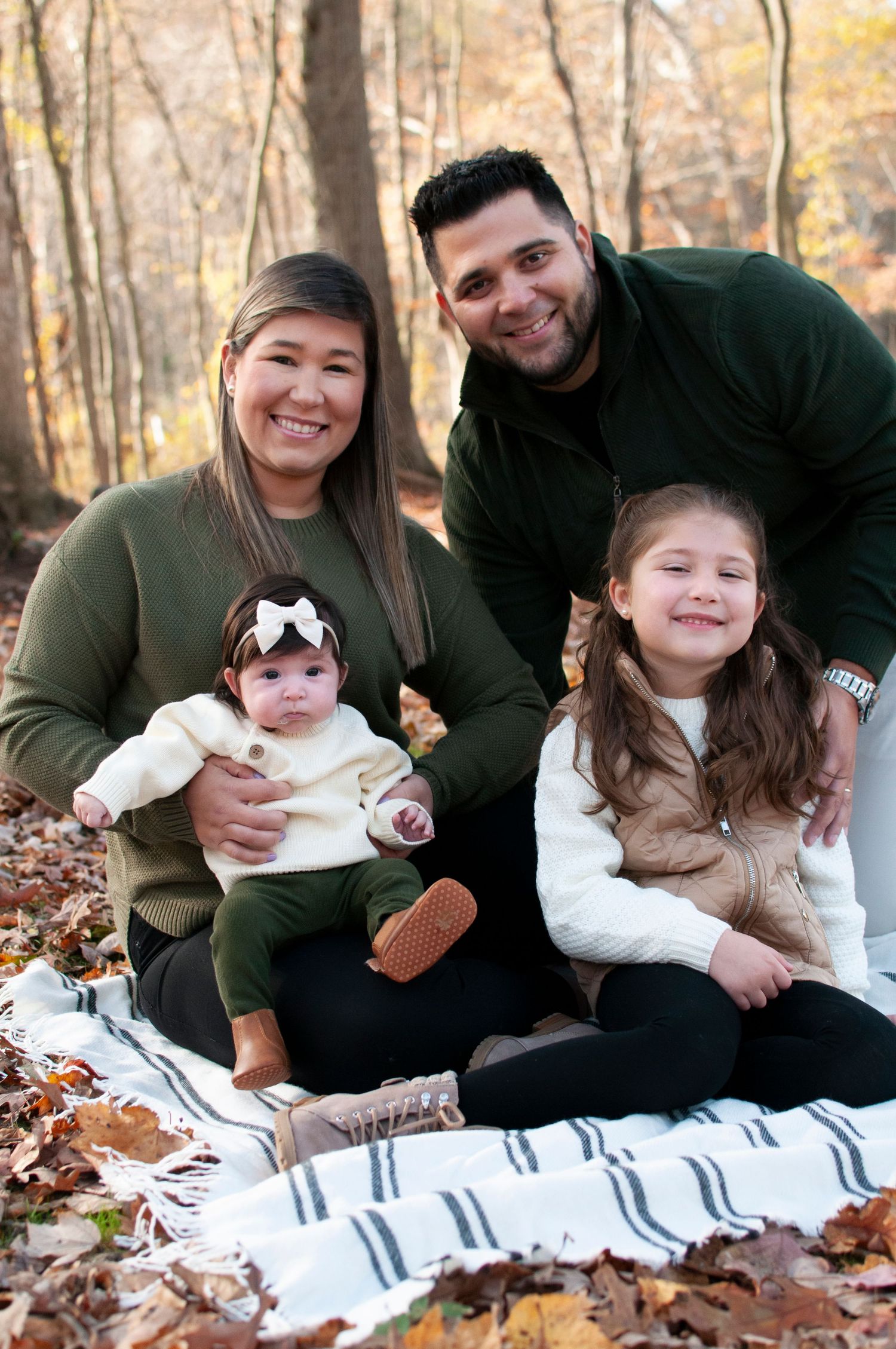 Family sitting together smiling fall photo two kids
