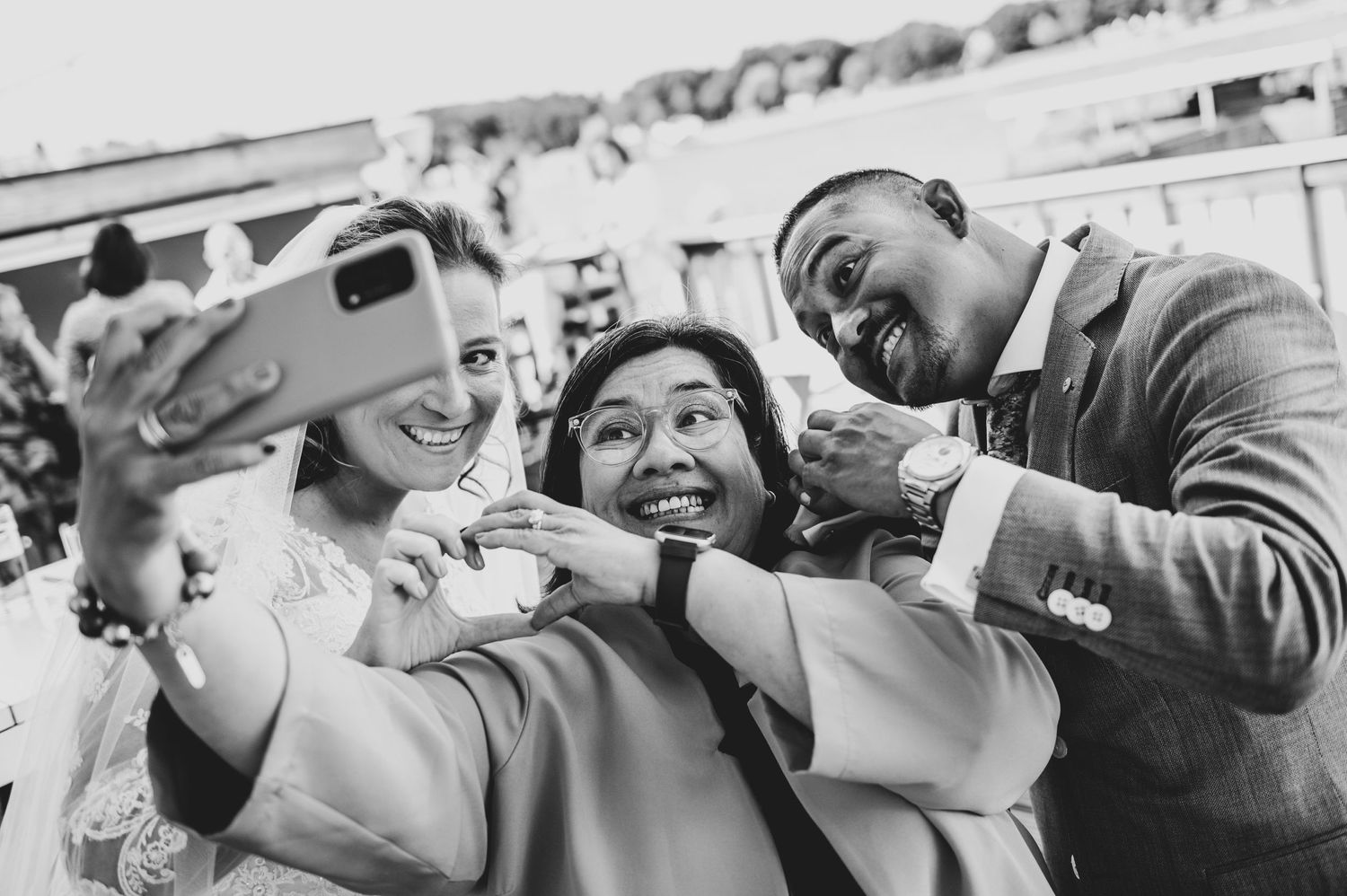 Black and white candid wedding moments showing couples embracing and dancing in a romantic setting.