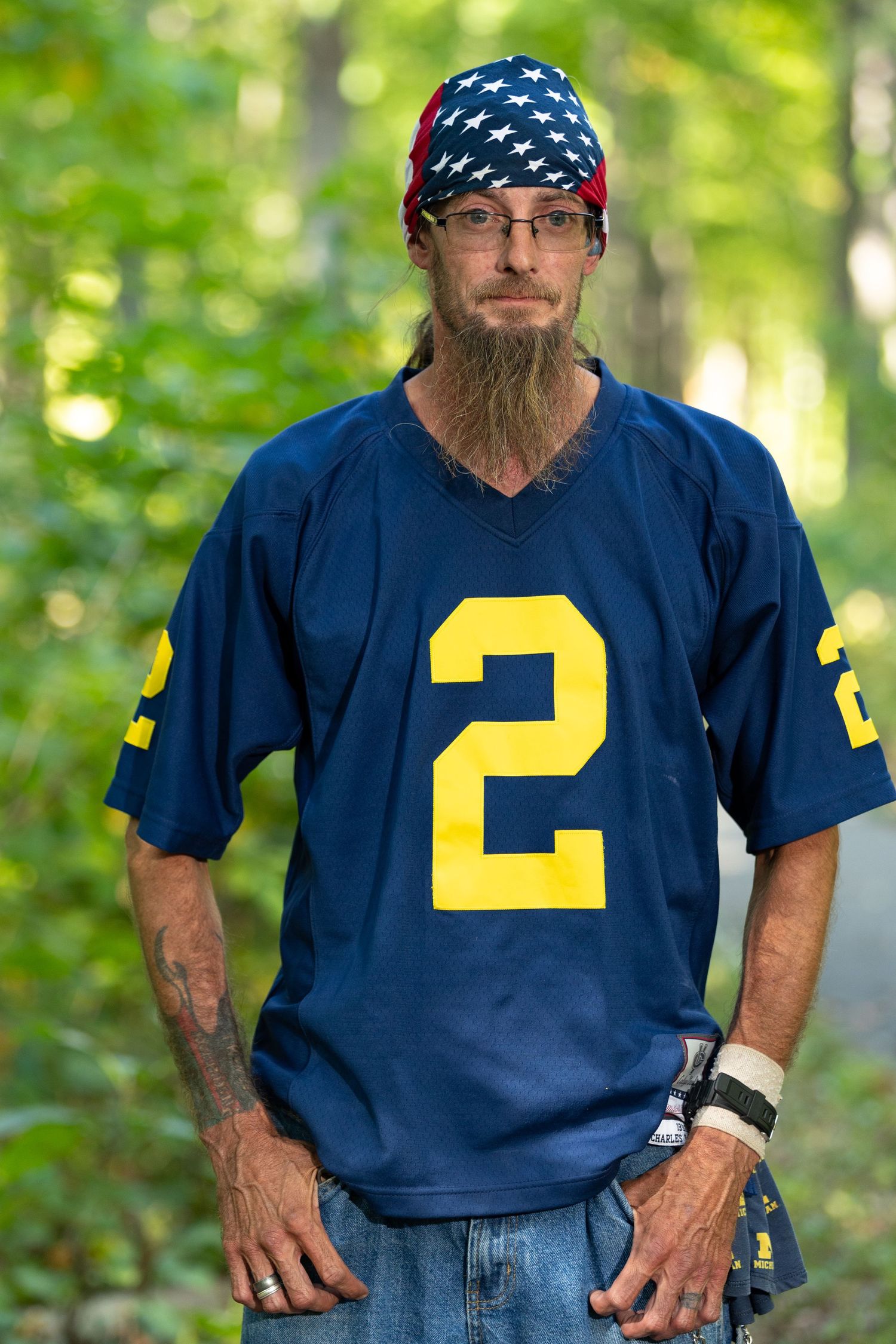 A man posing with hands on hips.
