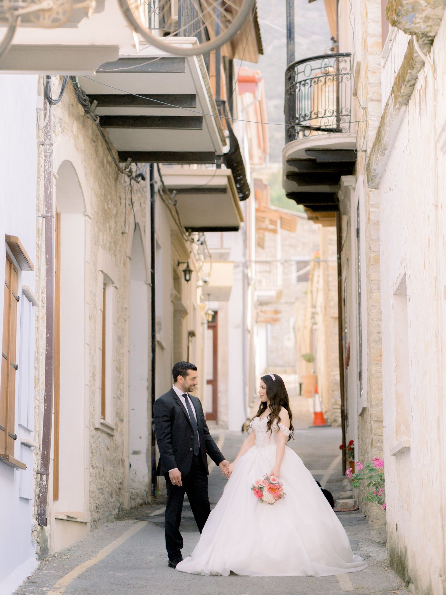 Bride a groom holding hands in Lefkara Village