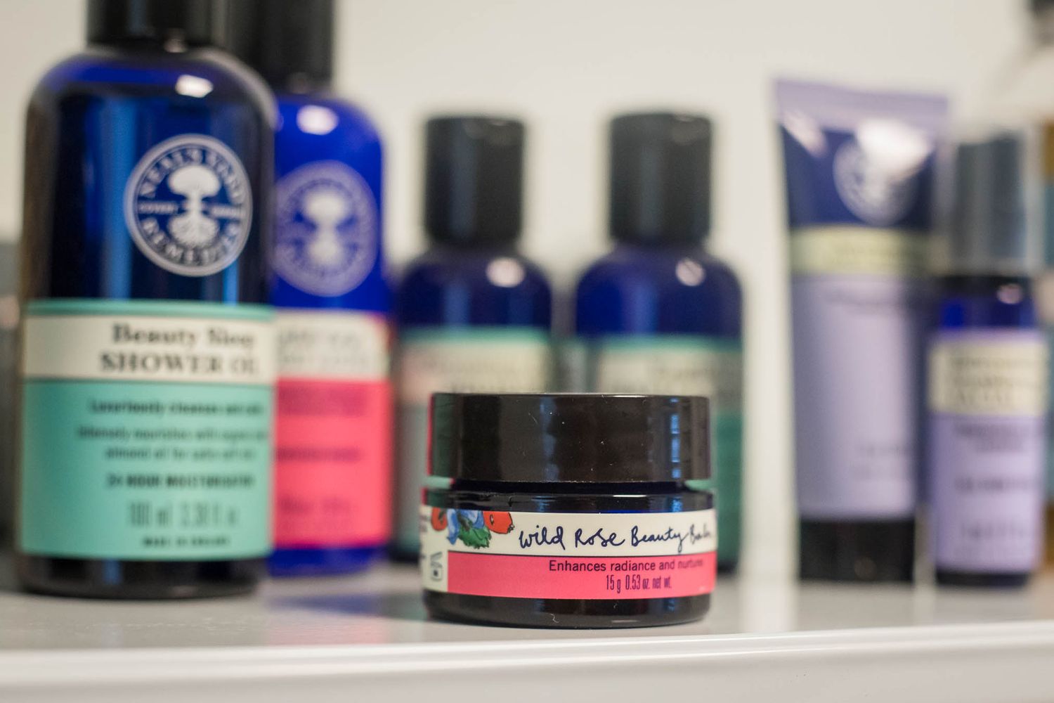 Images of beauty and herbal remedy products in a line on a shelf