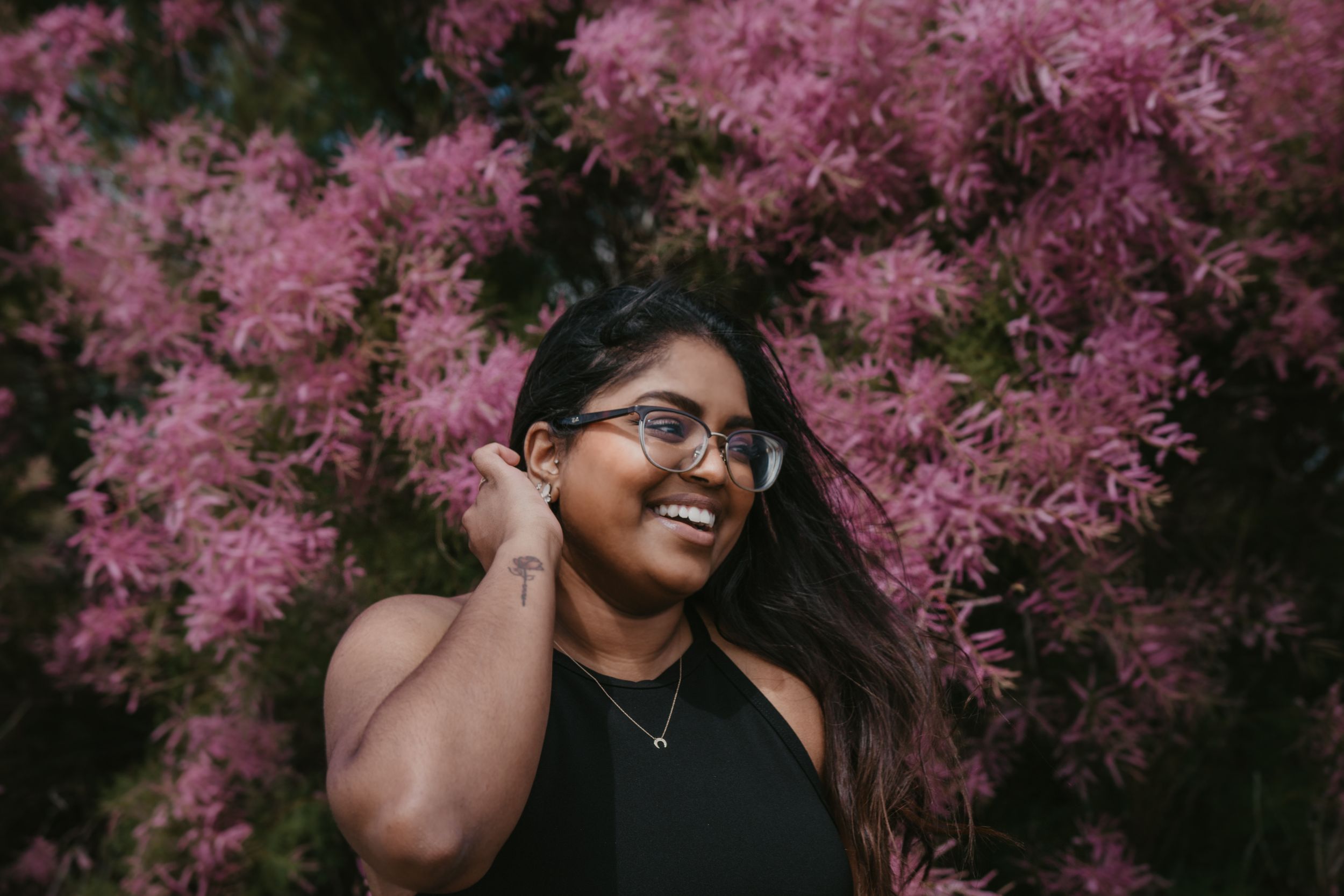 Candid Portrait Photo in front of spring flower