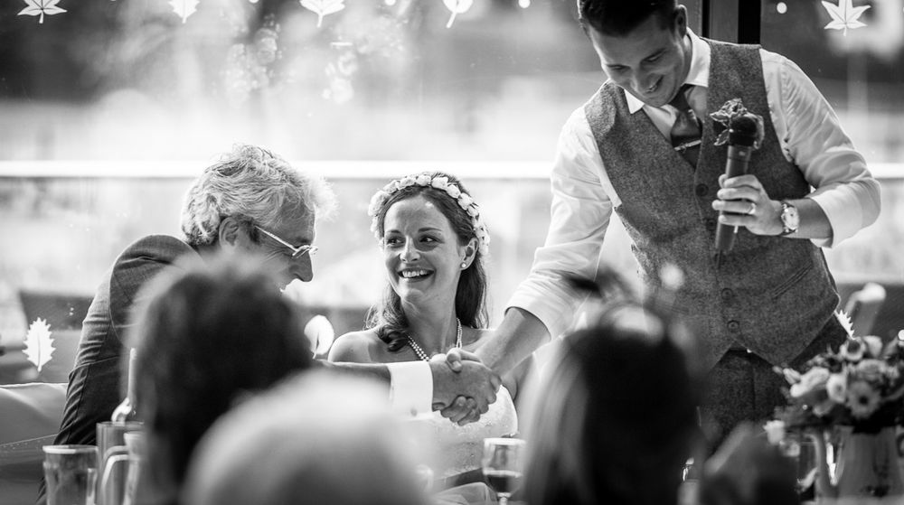 Son in lay and bride shaking hands, photo by Tony Cullinane, a Belfast based wedding photographer
