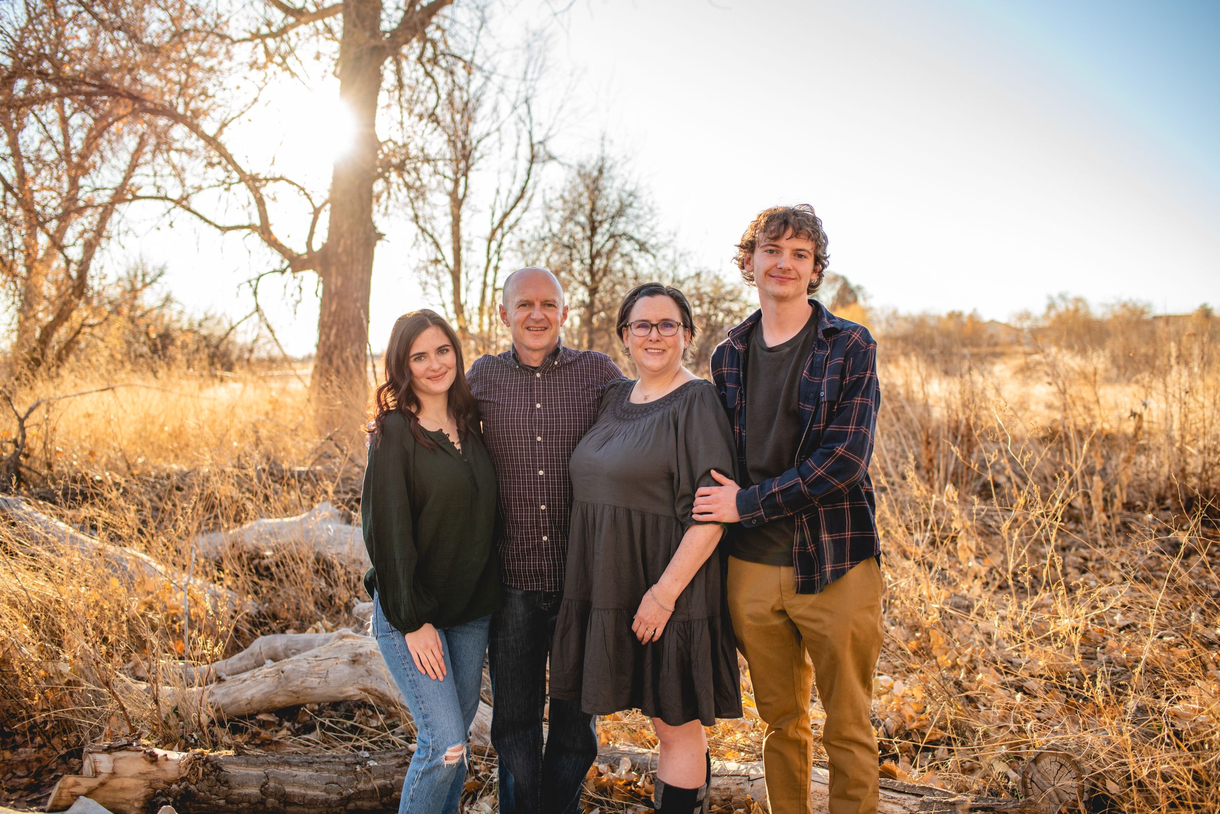 Family of 4 fall at McKay Lake park during the sunset for fall time portraits