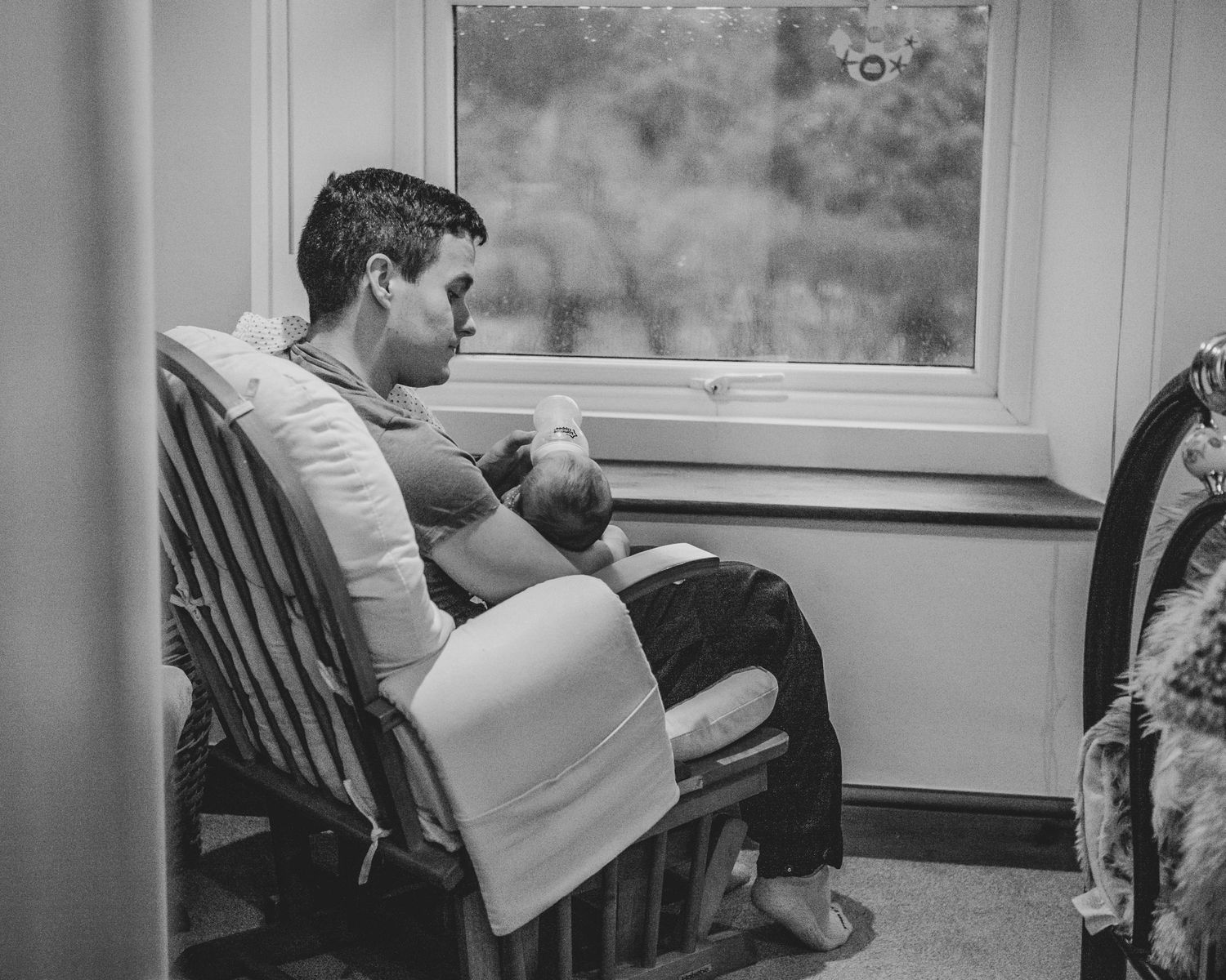 New born at home photo shoot with Cornwall new born photographer dad and baby