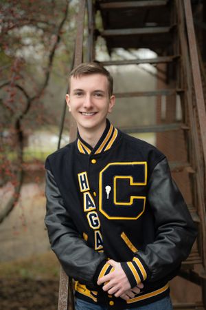 boys senior pictures in letterman jacket
