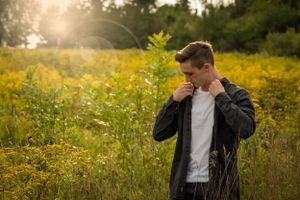 boys senior pictures in field