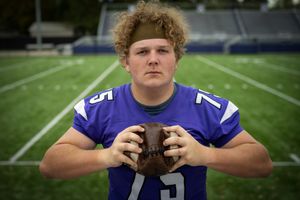 boys senior pictures football field