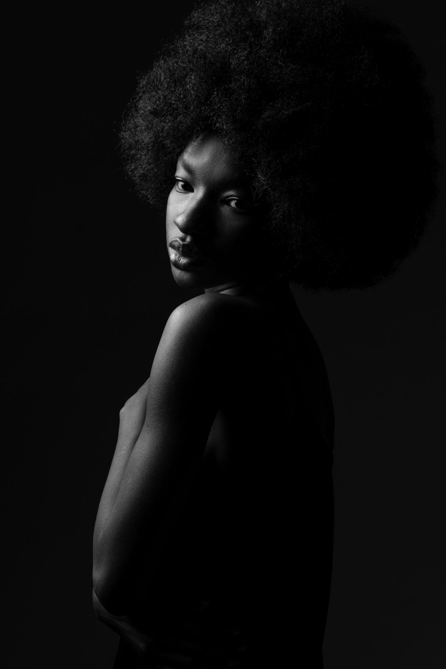 A woman posing for her photo session in the studio in London, UK
