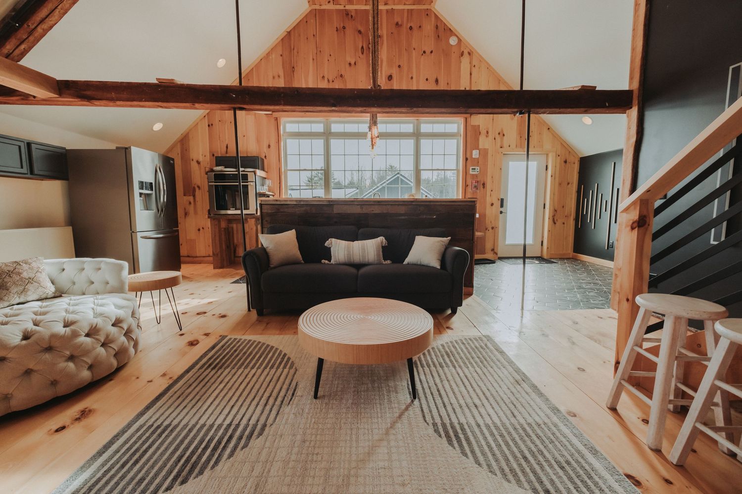 The living room and kitchen area at Moonlit Ridge is absolutely gorgeous!
