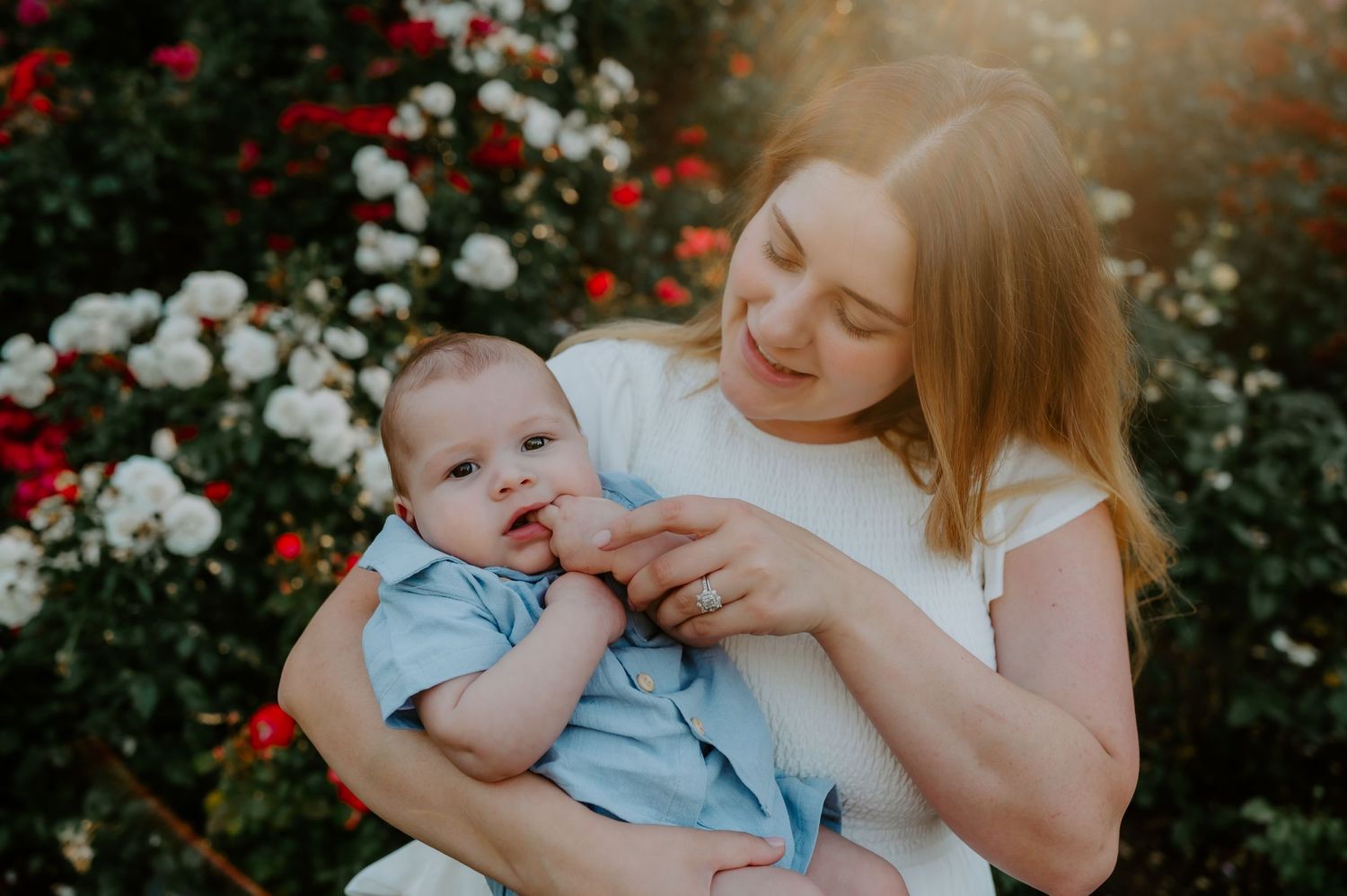 Mother holds her baby
