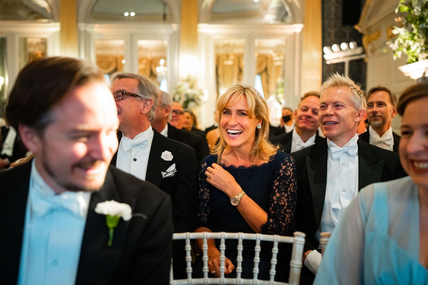 Happy guests watching wedding ceremony at Claridges Hotel