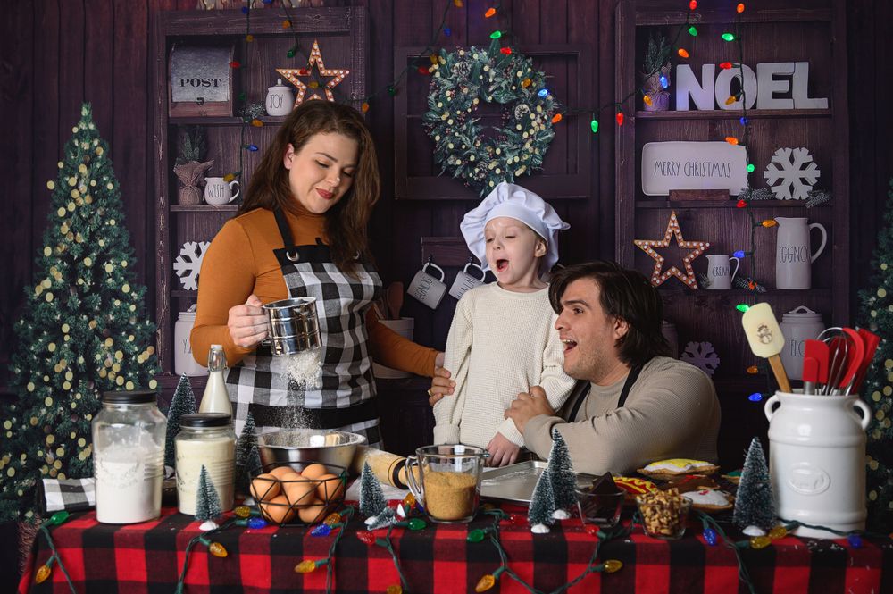 Family baking session in festive kitchen setting with Christmas decorations and plaid accents.