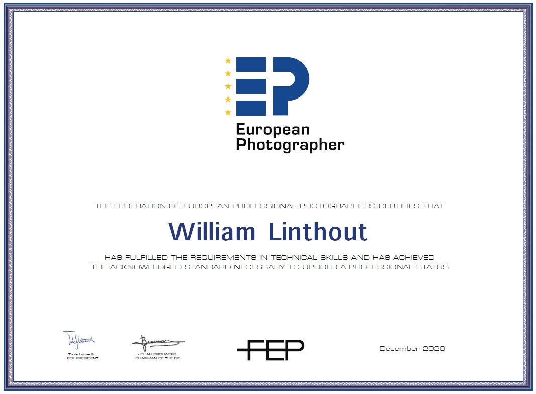 Official European Photographer certification diploma in blue frame.