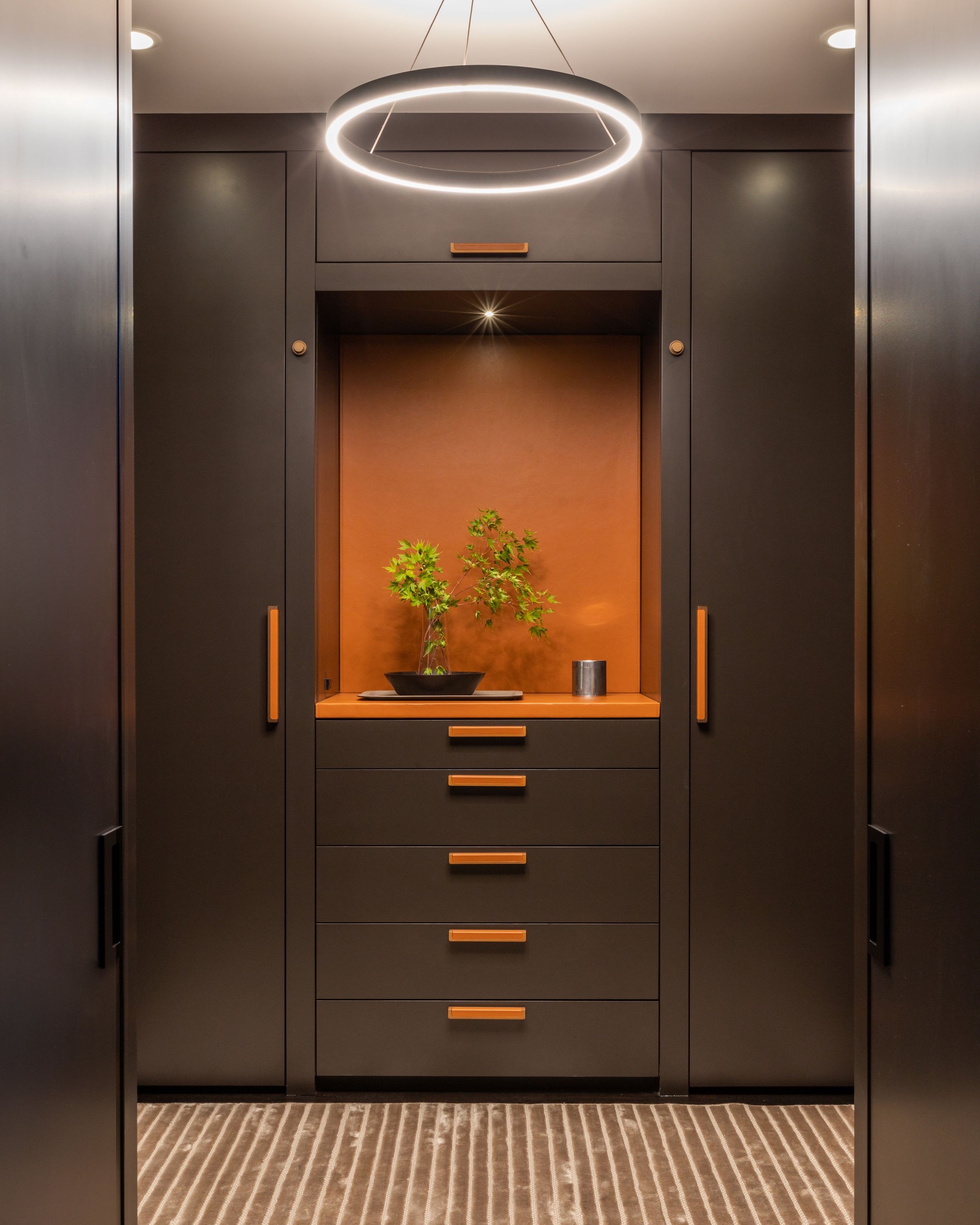 Custom designed men's closet with Hermes orange