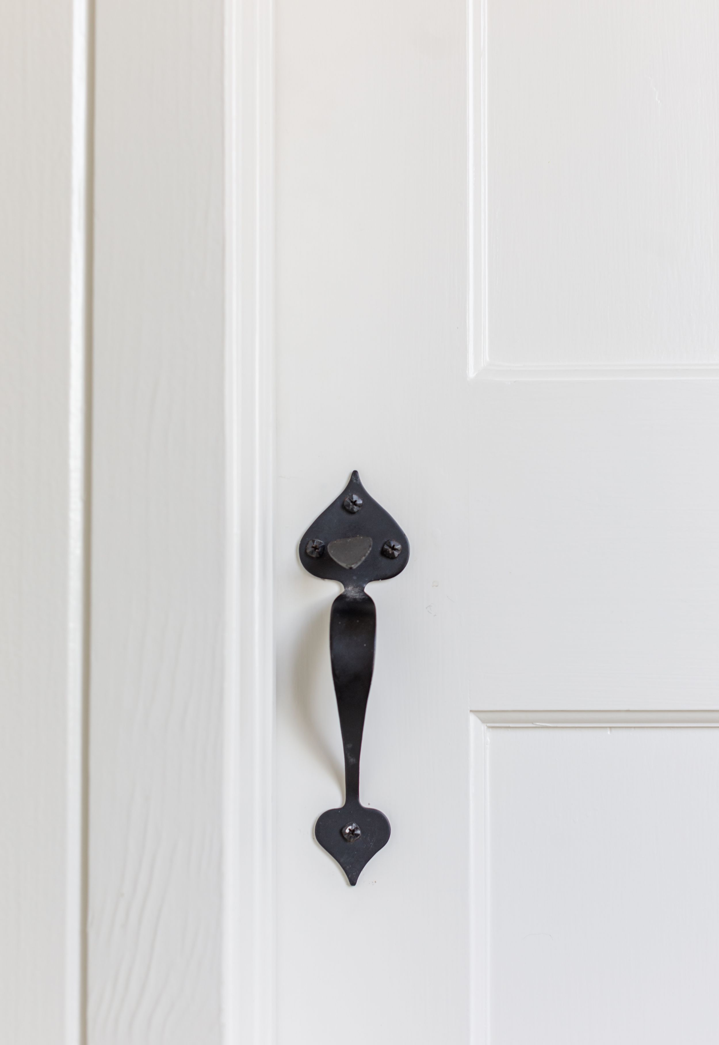White door with iron handle
