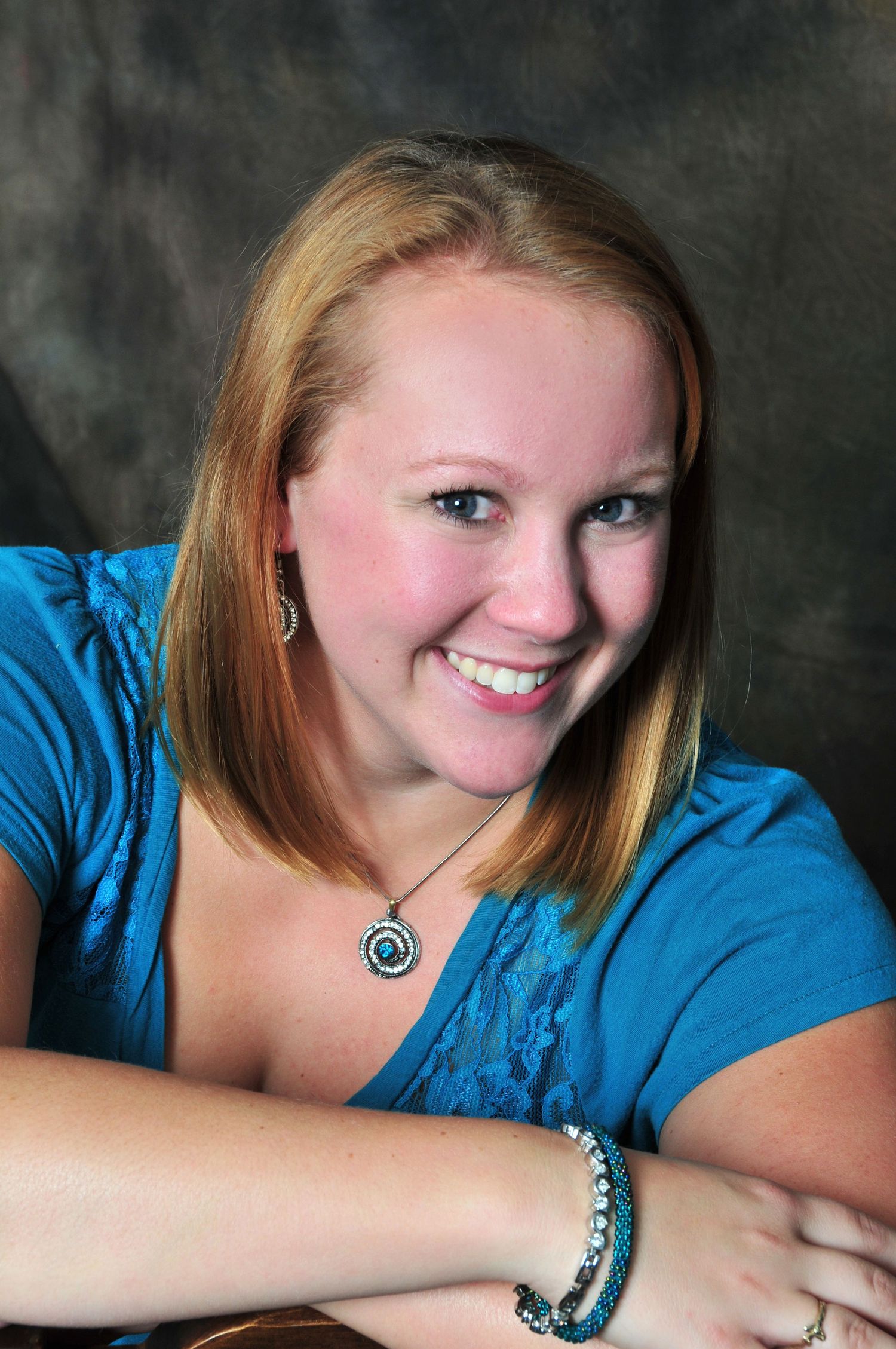 business headshot of woman wearing blue