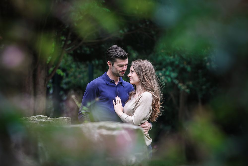 Young coiple in love hold each other during a tender moment in the park