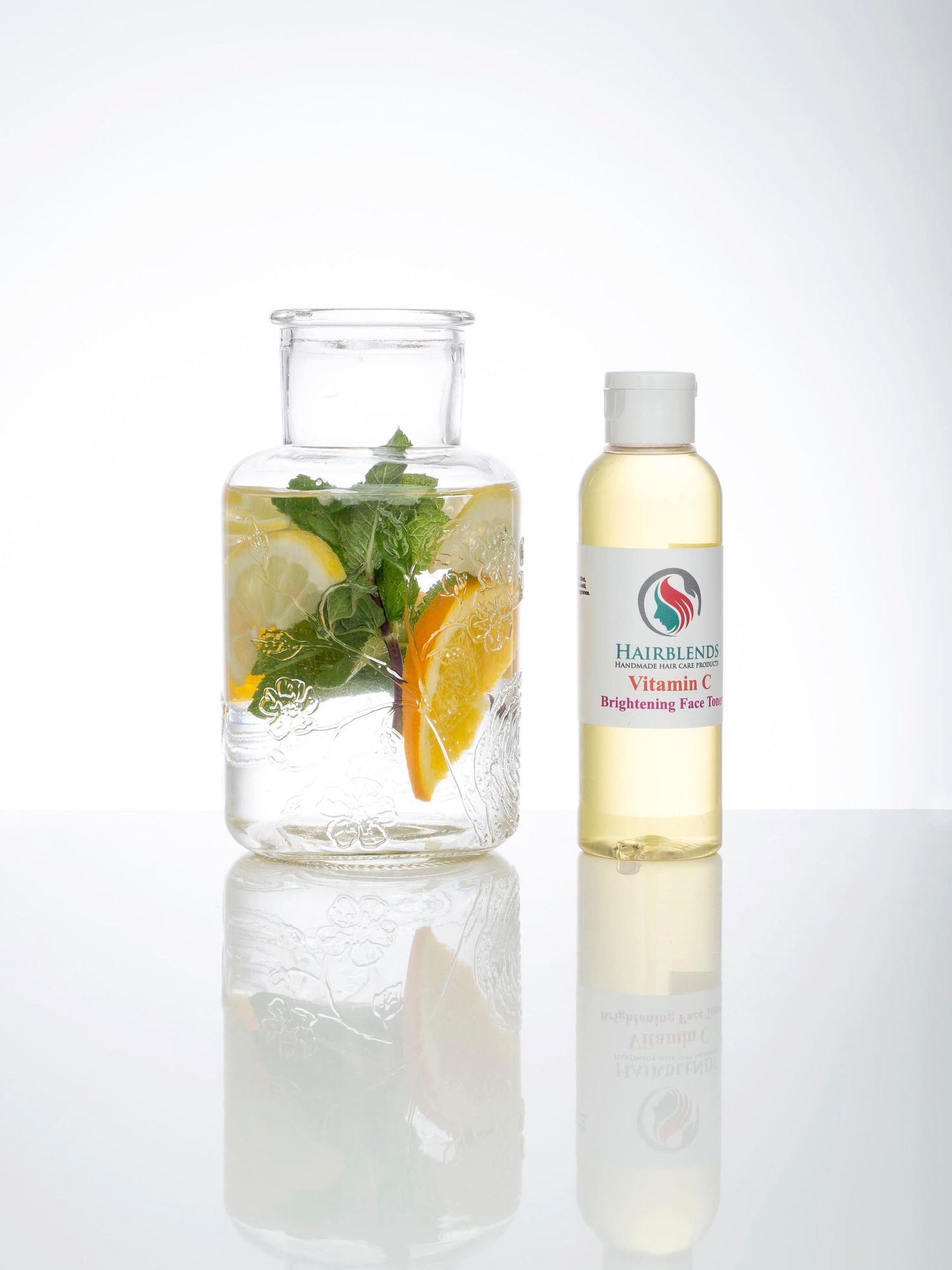 Creative product photography of a glass jar with a vitamin C serum bottle, captured in a studio environment. Branding photo Abigail's Studio
