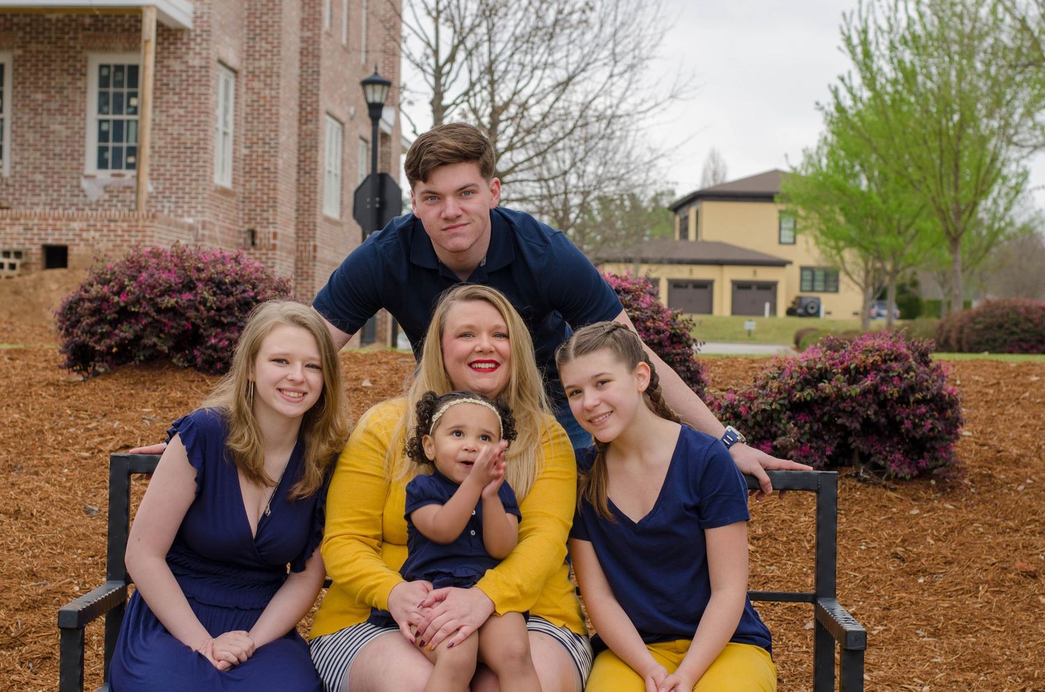 Family Outdoor Photo Session with Yellow and Blue Outfits in North Augusta SC
