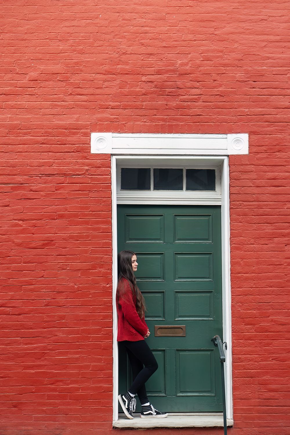 high school senior of 2024 poses in winchester VA doorway