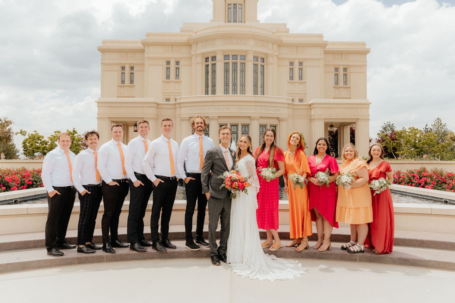 Bridal Party posing in bright pink and orange at Payson, UT LDS Temple
