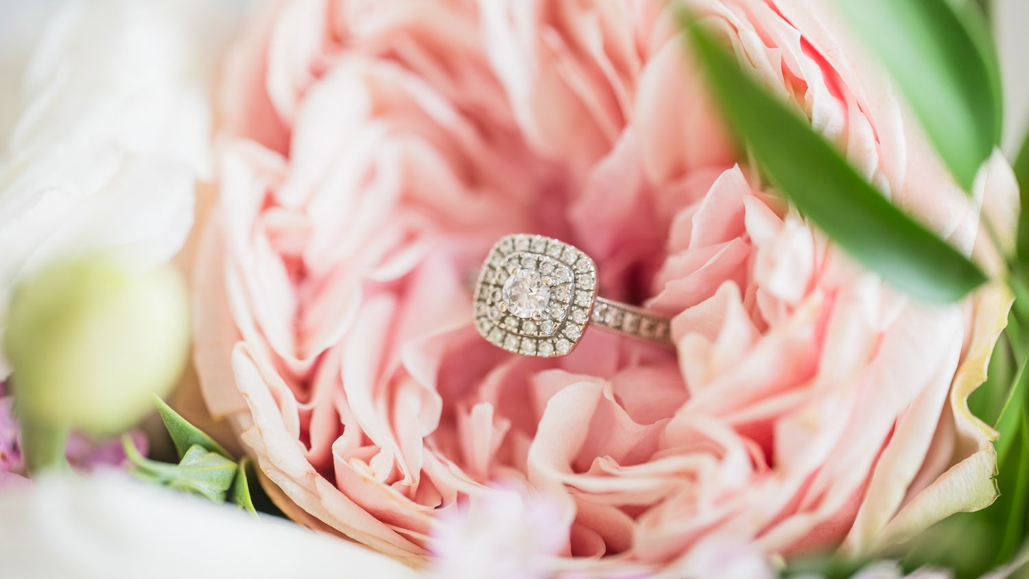 Engagement ring over bridal flowers