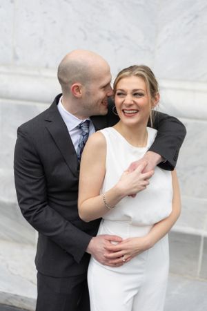 Newly eloped Columbus couple cuddling near the Scioto Mile