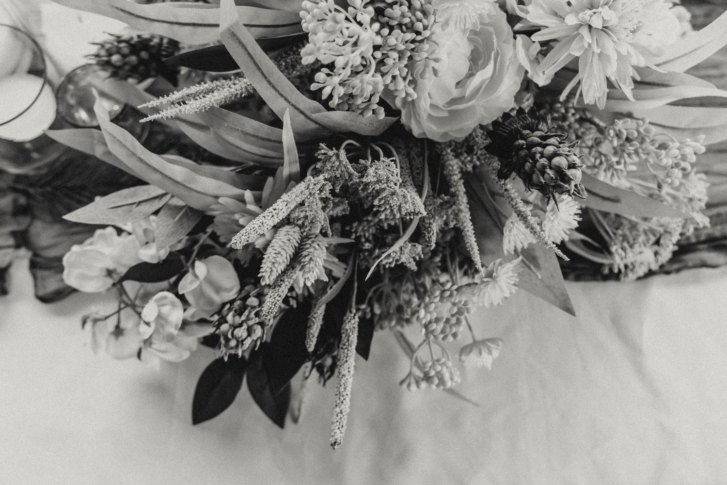 Beautiful floral arrangement with white roses and delicate baby's breath flowers.