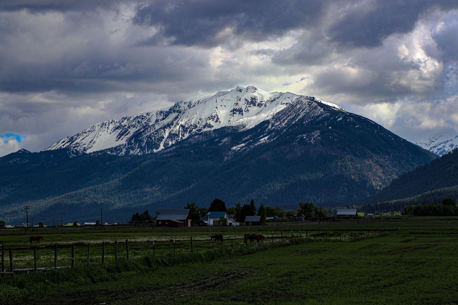 Farmland nestled below the Wallowa Mountain Range outside of Joseph, Oregon