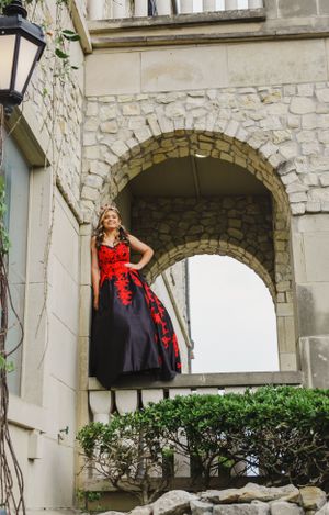 Stone archways and columns frame a scenic architectural view of a historic building.