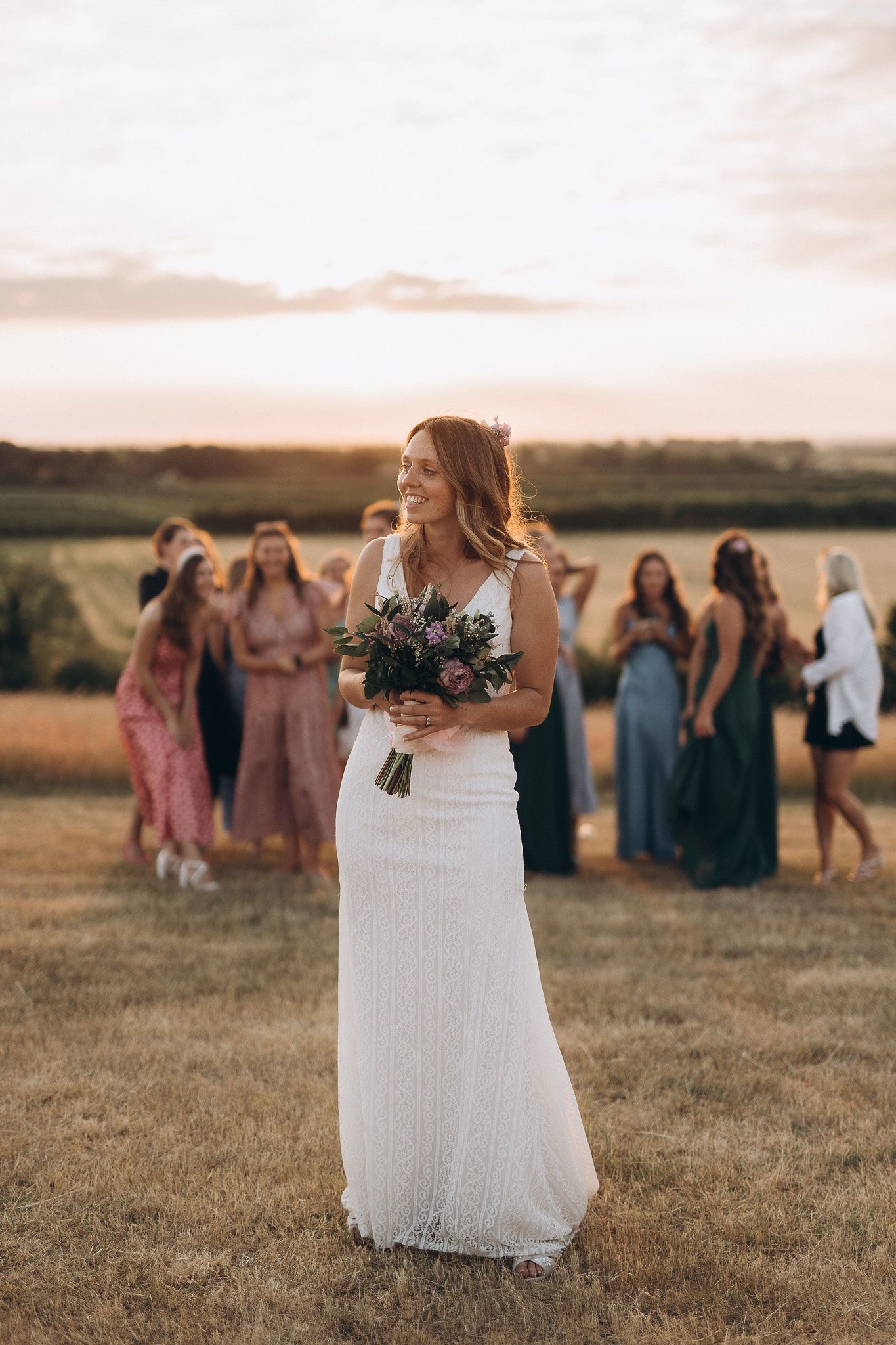 Documentary-style wedding photography of the bride with stunning views of the countryside