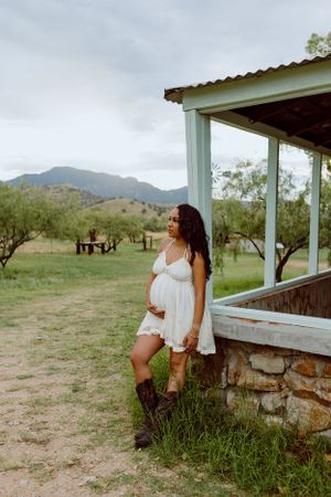 A desert landscape with mountains and a stone porch in natural lighting.