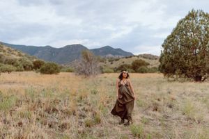 Beautiful desert landscape with mountains and brush during a maternity session.