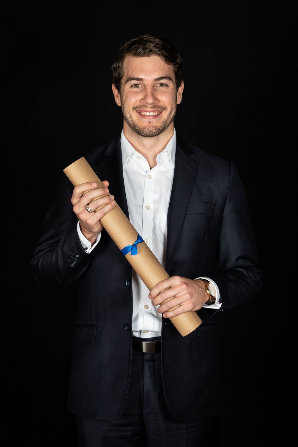 charterholder portrait of a man against a black background