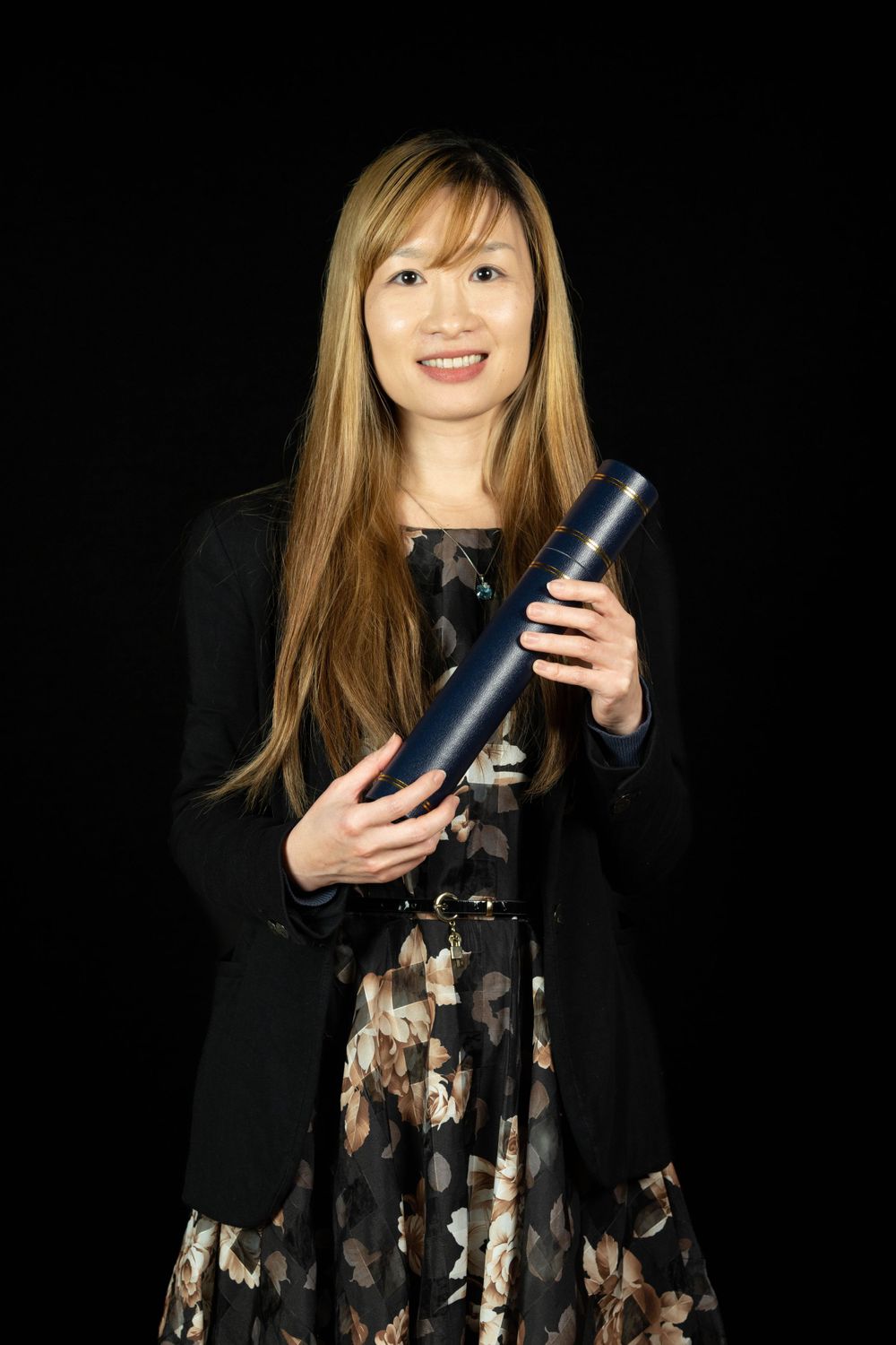 charterholder portrait of a woman against a black background