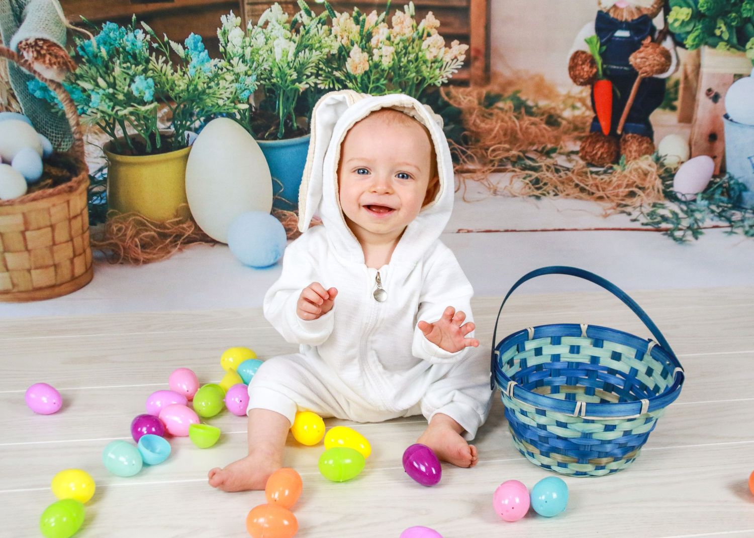Easter scene with colorful plastic eggs scattered on floor near baskets and decorations.