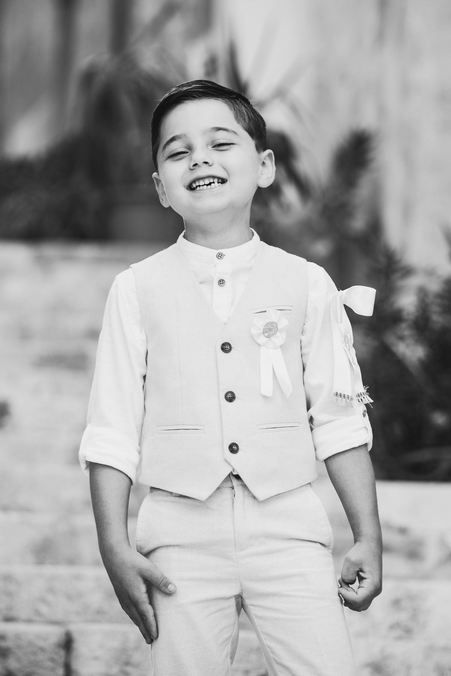 Black and white portraits showing joyful expressions in formal attire.