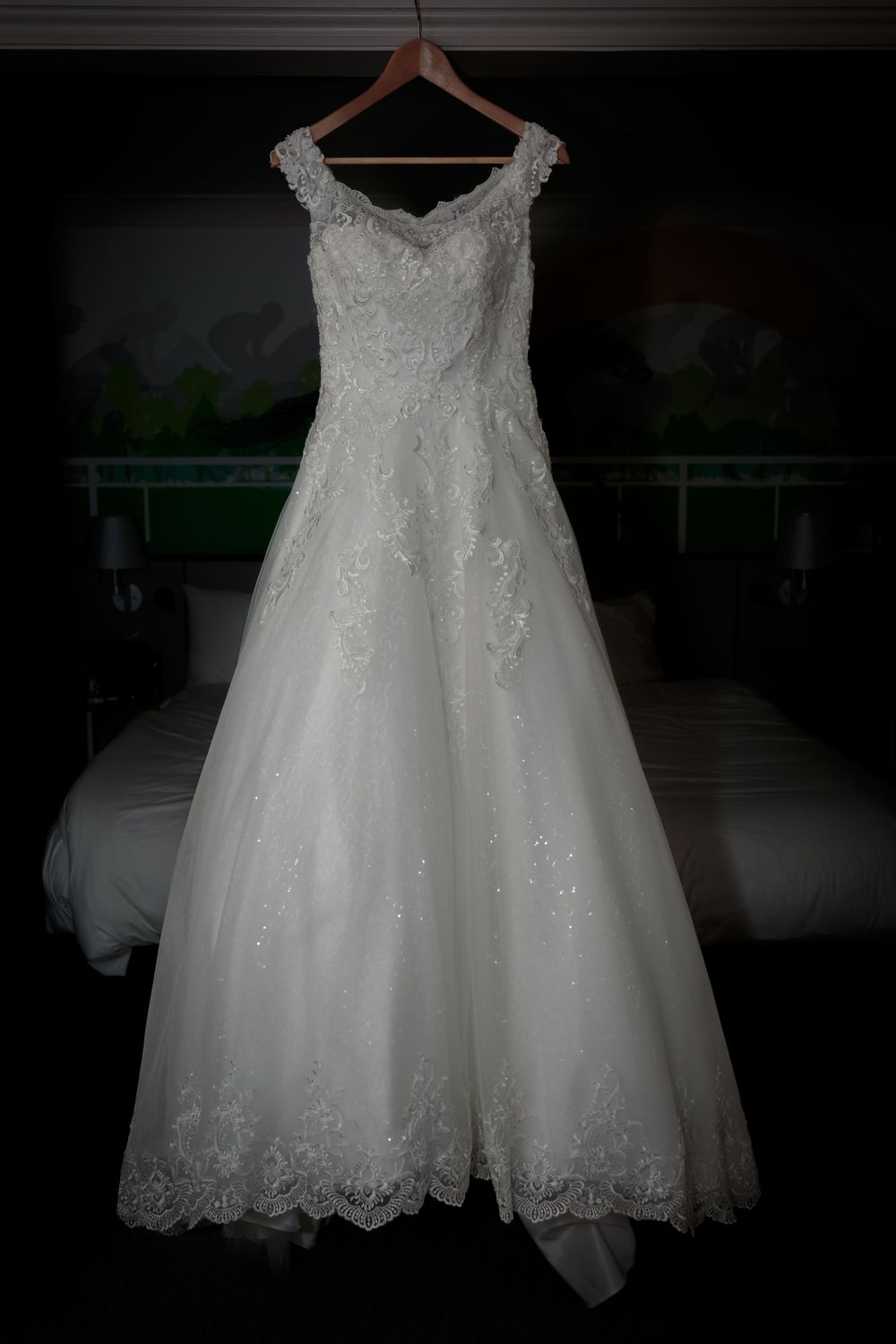brides beautiful dress hanging up in the room at the mercure hotel in haydock
