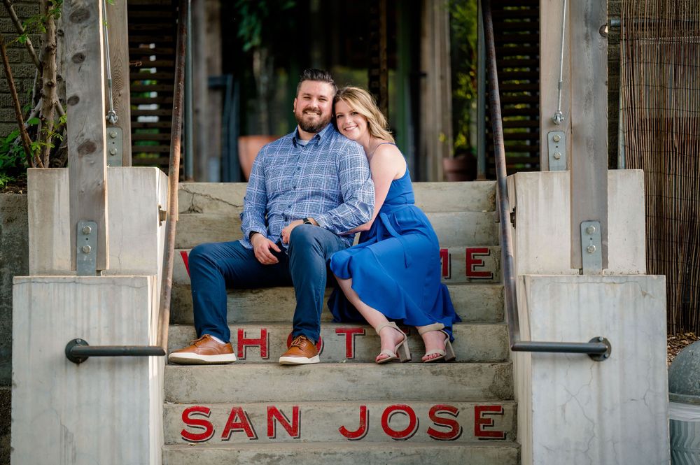 Couple sitting together on San Jose steps outdoors.Congress Avenue Engagement session Austin