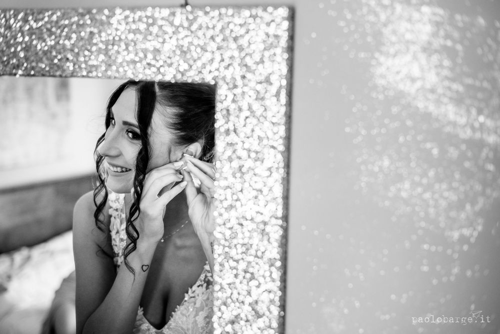 Black and white reflection showing elegant wedding preparations.