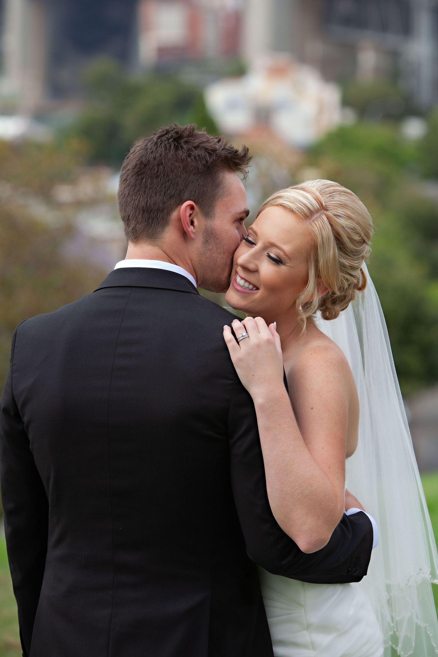 The groom telling his new wife something special. Wedding Photographer in Suffolk & Norfolk.