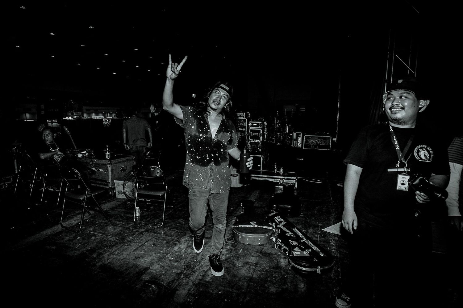 High-energy live music performance captured in black and white photography.