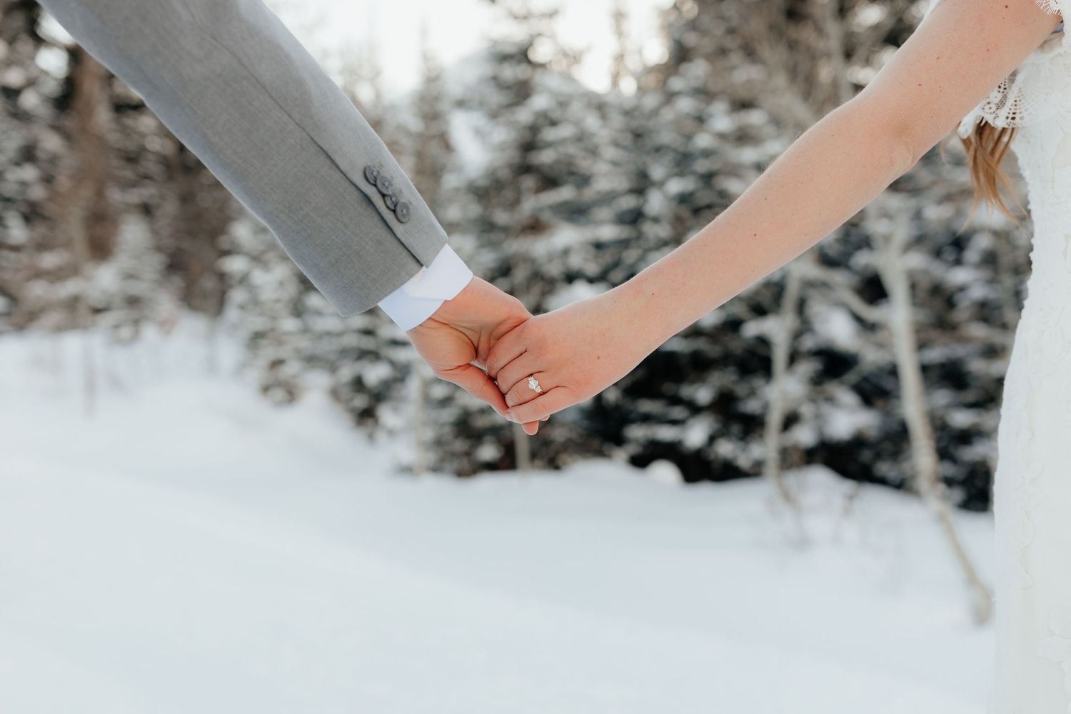 Newly married couple holding hands