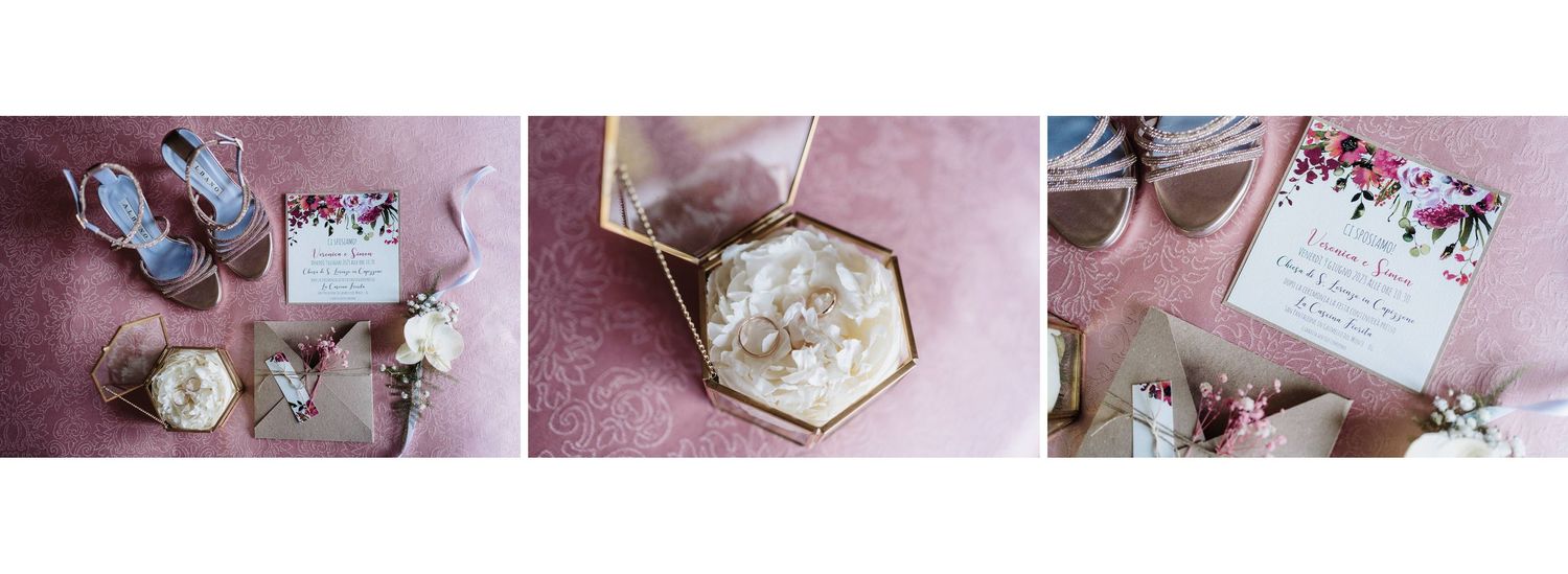 Elegant wedding flat lay featuring hexagonal ring box with pearl earrings, floral invitation, and bridal accessories on pink.