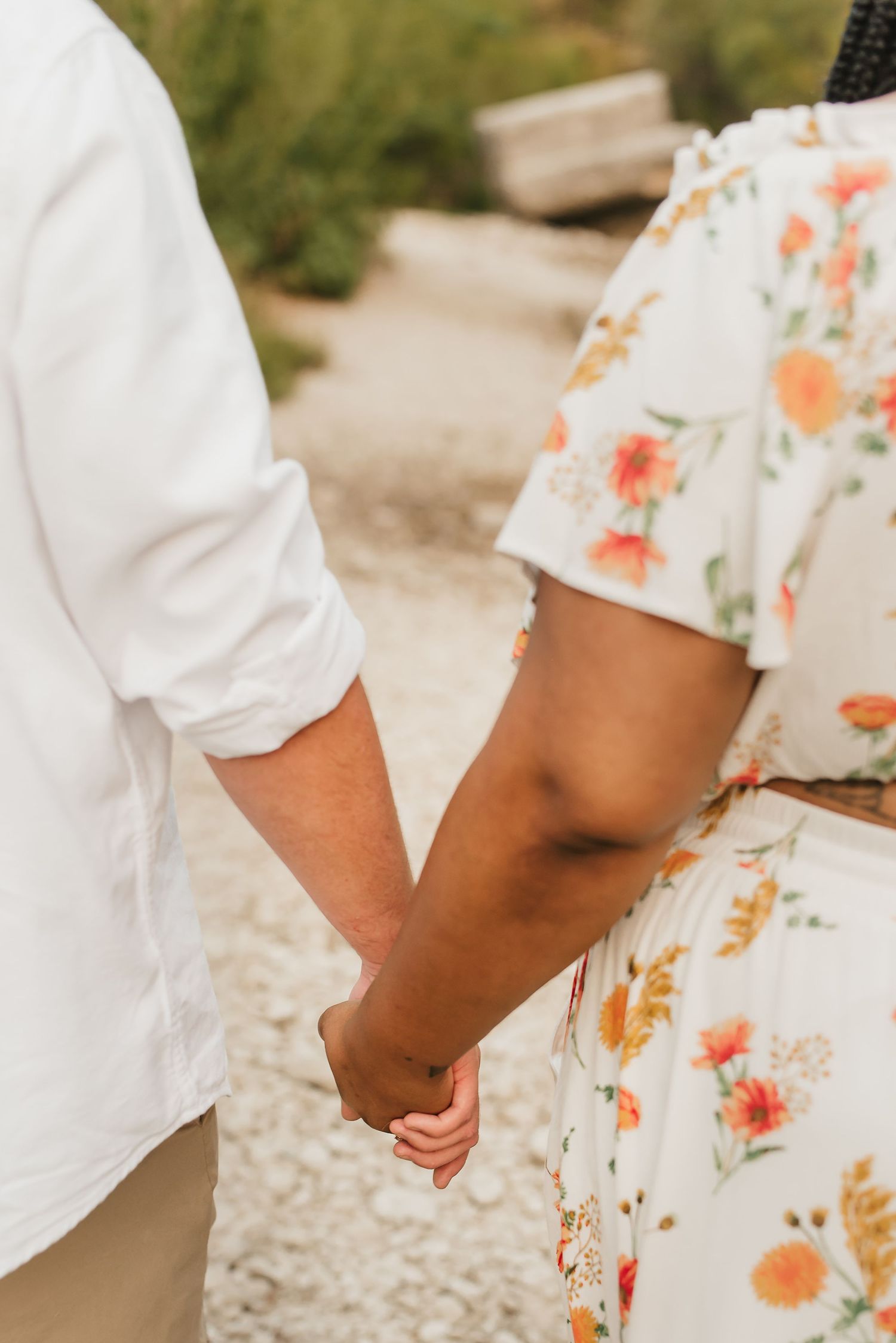 couple holds hands in sweet photo session